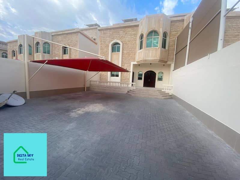 Seize the opportunity, a villa for rent in Khalifa City A, 5 master rooms, an internal garden, internal parking, with an automatic garage door, a maid’s room, a laundry room, and a guard’s room next to all services.