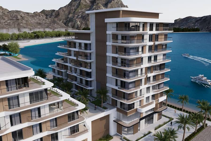 Three-room apartment with maid’s room, direct view of the charming Khor Fakkan Sea, 10% down payment, freehold