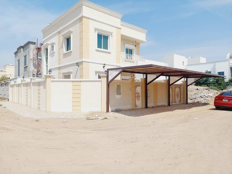 Two-storey villa for rent in Ajman, Al Helio area 3 master bedrooms And a meeting room And a maid's room Corner on two streets Indoor umbrella and outdoor umbrella First resident 85 thousand dirhams are required
