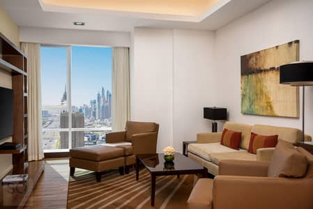 شقة فندقية 2 غرفة نوم للايجار في الصفوح، دبي - Deluxe Two Bedroom Apartment_Living Room. jpg