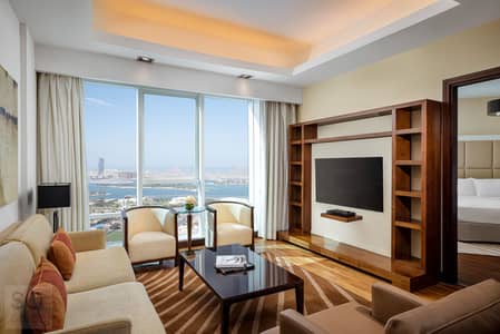 1 Bedroom Hotel Apartment for Rent in Al Sufouh, Dubai - Deluxe One Bedroom Sea View Apartment_Living Room. jpg