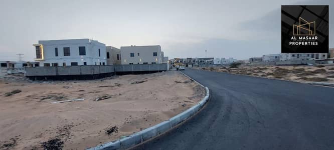 Residential lands for sale, Umm Al Quwain Villas, directly on Al-Raisi Street, includes all votes, freehold for all nationalities