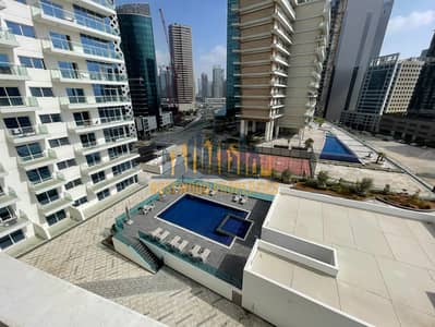 Studio for Rent in Business Bay, Dubai - LARGE AND BRIGHT STUDIO WITH BALCONY | POOL VIEW