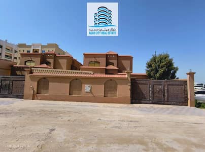 illa for Rent in Al Mowaihat  | 5 Bedrooms - Hall & Majlis | 5000 SQFT | This spacious villa located in Al Mowaihat 3