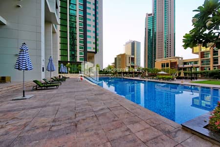 فلیٹ 1 غرفة نوم للبيع في جزيرة الريم، أبوظبي - abu-dhabi-al-reem-island-marina-square-community-swimming-pool-1. JPG
