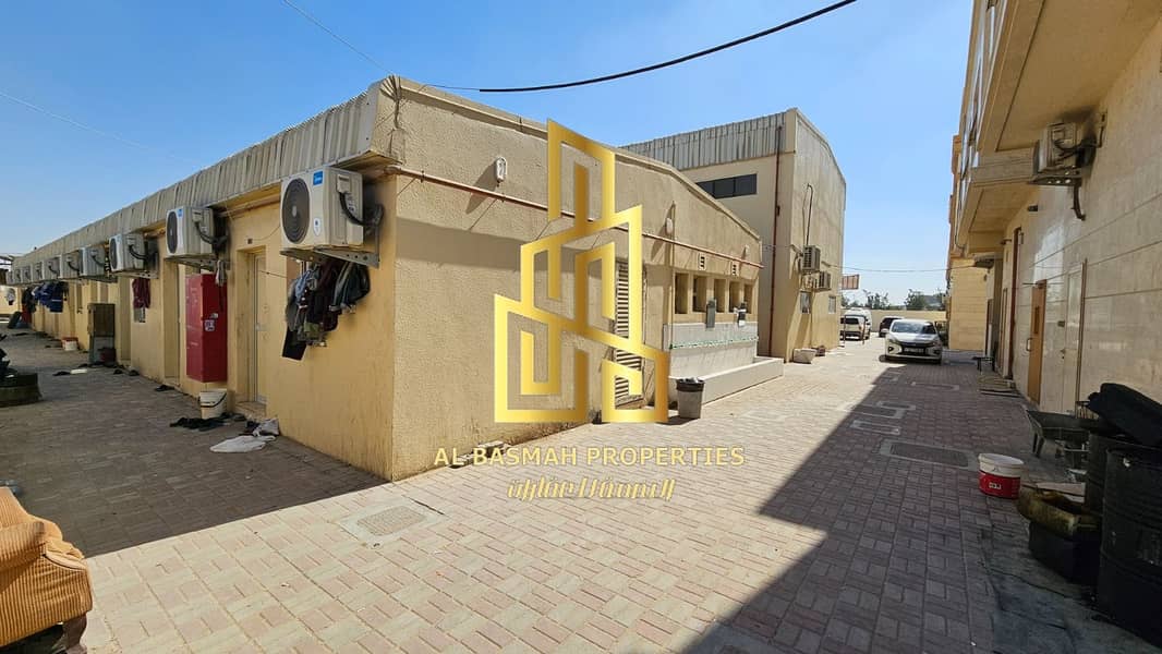 For sale, built land in the Emirate of Sharjah, Al Saja’a Industrial Area, on the main street
