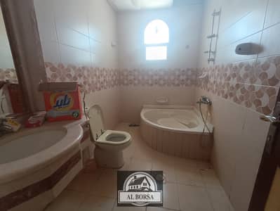 A villa for rent inside Al-Rawda 2, consisting of five rooms, a sitting room, a hall, a maids room, an indoor parking, an outdoor parking, and a cour