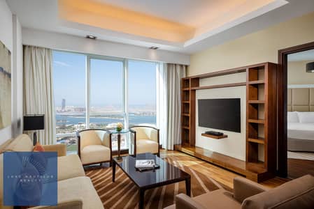 1 Bedroom Apartment for Rent in Al Sufouh, Dubai - Deluxe One Bedroom Sea View Apartment_Living Room. jpg