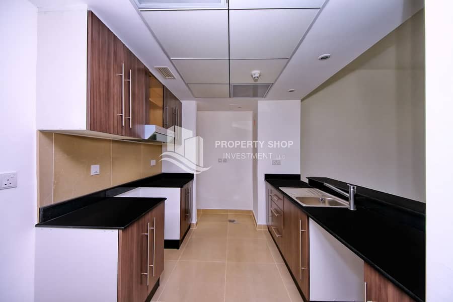 7 1-bedroom-apartment-abu-dhabi-al-reef-downtown-kitchen. JPG