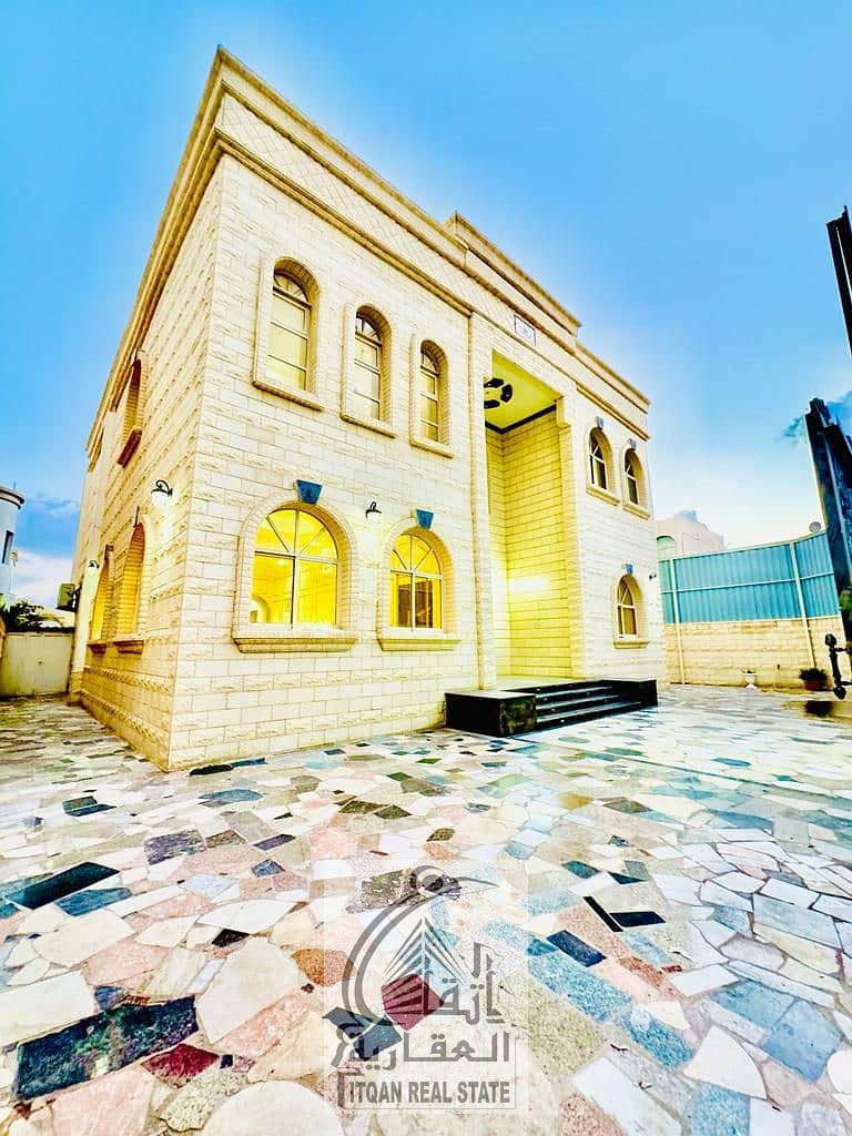 For rent, a villa in Al Rawda area, consisting of 5 rooms, a sitting room, a hall, and a maid’s room