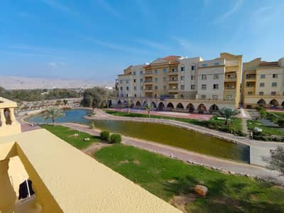 1 Bedroom Flat for Rent in Yasmin Village, Ras Al Khaimah - Lake and Mountain View | well maintained apartment | bld 12