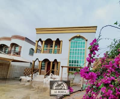 A beautiful villa for rent in Ajman, Al Rawda 1, with a charming view of Asphalt Street, in a very privileged location, cash in one payment.