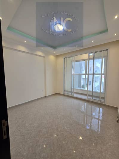A room and a hall for annual rent in Ajman, very excellent location in Rawda 3, with parking and a free month, at a very attractive price