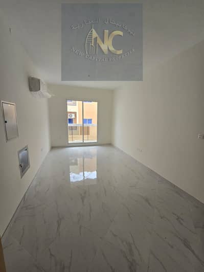 Two rooms and a hall for annual rent, new building, first resident in Al Hamidiya, close to the school complex