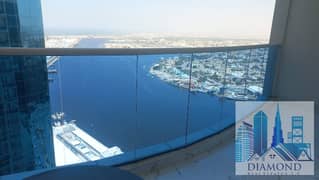 Two-room apartment with a living room, sea view on Ajman Creek, for sale, with furniture and car parking