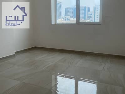 Apartment for rent in Ajman, two rooms and a hall in Al Nuaimiya 3, with parking, close to the Dubai and Sharjah exits