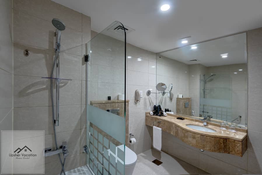 3 Ghaya Grand Hotel Dubai - Two Bedroom Bathroom 1. jpg