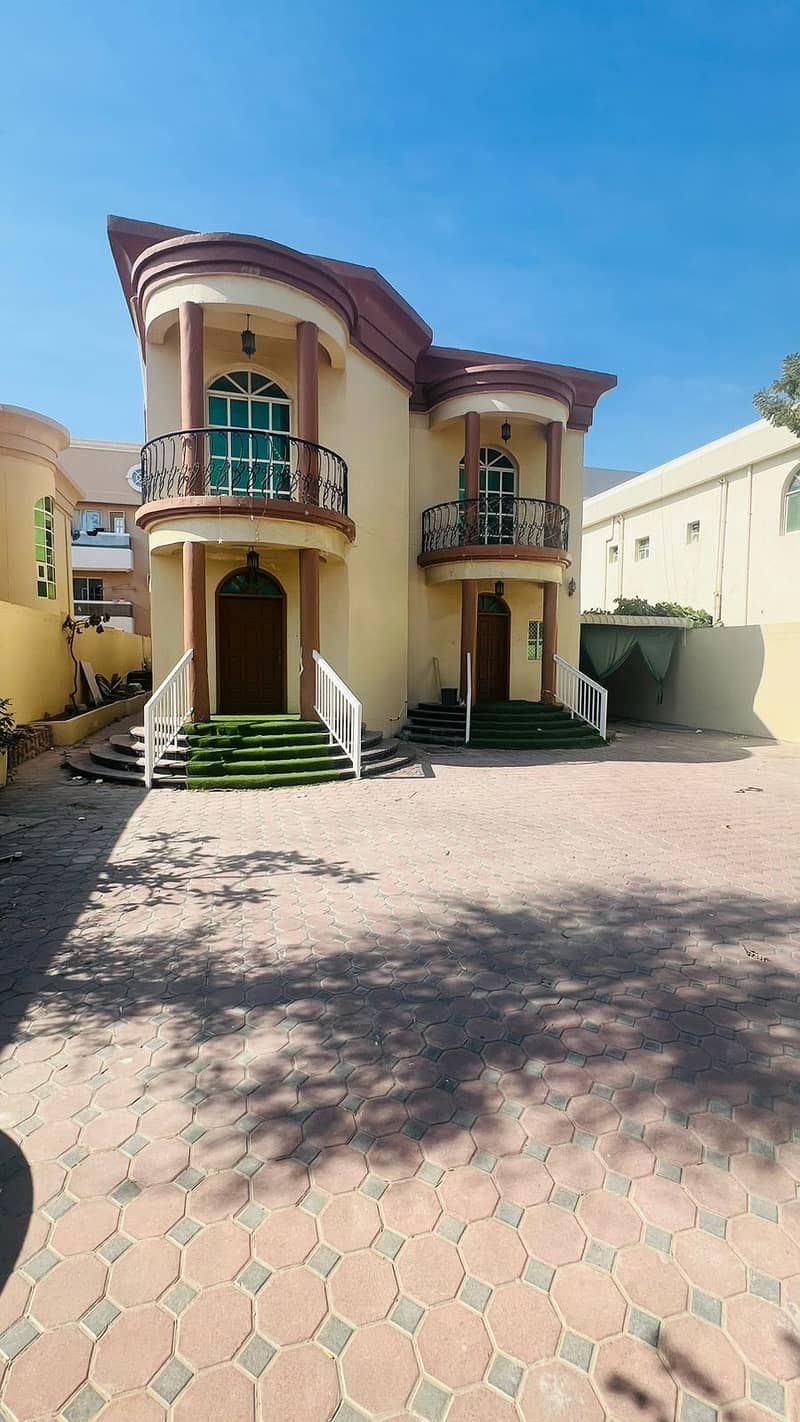 Villa for rent in Ajman, Al Rawda area 5 bedrooms, a living room and a living room With air conditioners 75 thousand dirhams are required