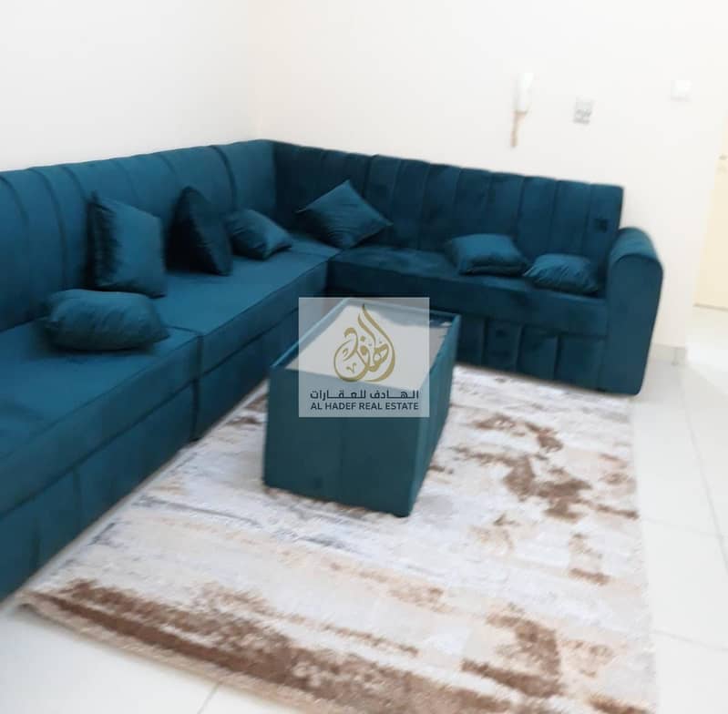 For rent in Ajman, a furnished room and hall for monthly rent, furnished with new furniture