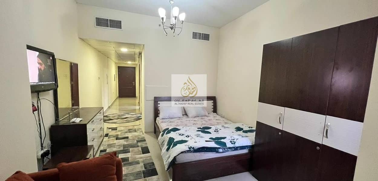 For rent furnished in Ajman, a furnished studio with clean brushes in Al Nuaimiya, Tower C, a large area with a balcony, including electricity, water,