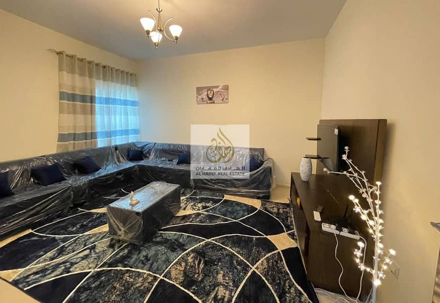 For rent in Ajman, a furnished room and hall for monthly rent, furnished with new furniture, in Ajman, a furnished apartment, a room and a hall, inclu