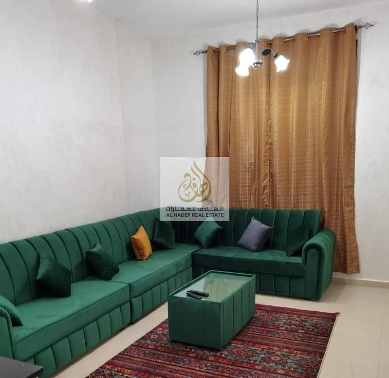 For rent in Ajman, an apartment, a room and a hall, furnished, very clean, in the City Towers, including electricity, water, sanitation and internet,