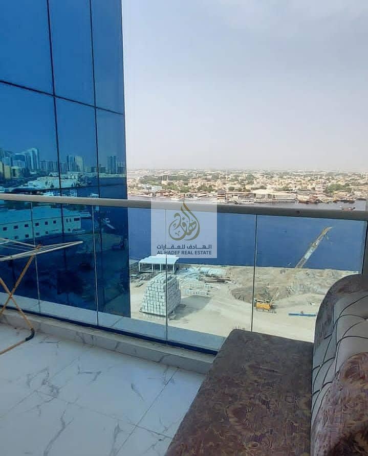 For rent in Ajman, two rooms and a furnished hall, for monthly rent, furnished, new furniture in Ajman, Al Waha Towers, with a very large area, close