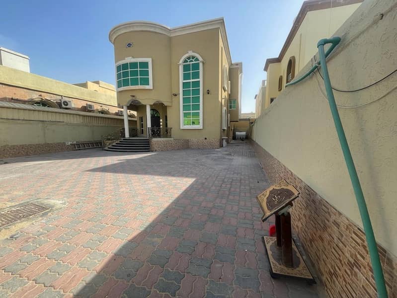 Villa for rent in Ajman, Al Rawda area 5 master bedrooms, sitting room, hall and maid’s room With air conditioners Area: 5500 square feet 85 thousand dirhams are required