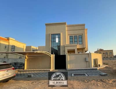 A beautiful villa for rent in Ajman Al Helio, featuring a charming view of the street at the corner of two cash streets at once