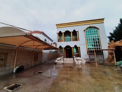 Villa for rent in Ajman, Al Rawda area 5 master bedrooms, a sitting room and a living room With air conditioners 90 thousand dirhams are required