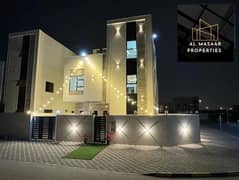Villa for sale, including electricity and water, at a very attractive price in the Emirate of Ajman, opposite Al Hamidiyah Park, full bank financing f