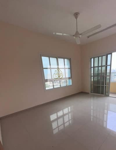 Two rooms, a living room, 2 bathrooms, and a balcony with an excellent, open and high view  A prime location in Al Rawda 2, close to Kenzi Hypermarket