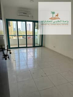 Three rooms and a hall, very spacious, in a special place in Al Majaz 1, Sharjah, on Corniche Street, at a price of 38 thousand