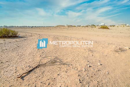 Plot for Sale in Al Shamkha, Abu Dhabi - Single Row | On The Main Road | Perfect Investment