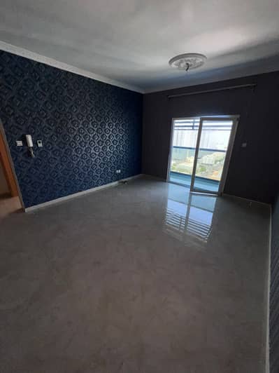 A large area room and hall with 2 bathrooms, with a balcony and an open view, Al Nuaimiya 3, behind Al Murad Mall. The price is 33 thousand annually o