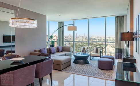شقة فندقية 1 غرفة نوم للايجار في شارع الشيخ زايد، دبي - Sheraton Grand Hotel, Dubai - 3 Bed Apartment - Living Room City View - Copy. jpg