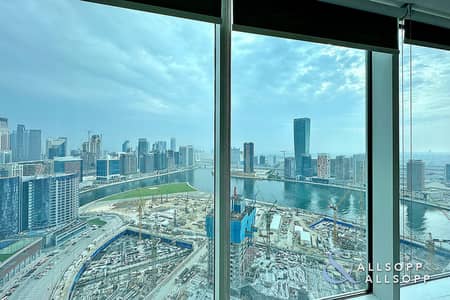 Office for Rent in Business Bay, Dubai - HIGH FLOOR | CANAL VIEW | PARTITIONED
