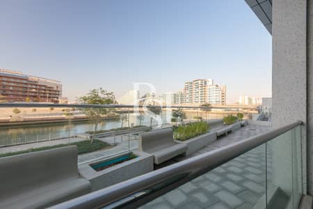 استوديو  للايجار في شاطئ الراحة، أبوظبي - c2631-channel-street-al-raha-beach-abu-dhabi- balcony-view (1). jpg