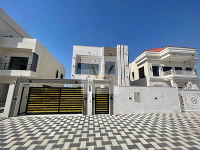 Villa for sale for the first resident in Al Helio, Ajman, including registration fees, with the possibility of bank financing, freehold for all nationalities, with modern features and finishes, payment facilities, and speedy implementation of the sale, wi