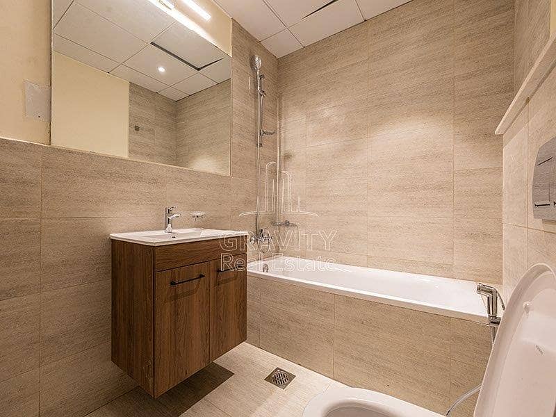 7 squeaky-clean-washroom-with-covered-shower-area-with-glass-panels-oasis-masdar-city. jpg