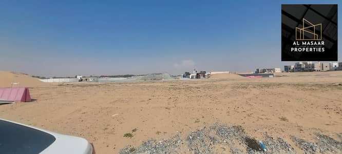 Land for sale in Al Helio, Ajman, including registration and ownership fees, freehold installments for all nationalities