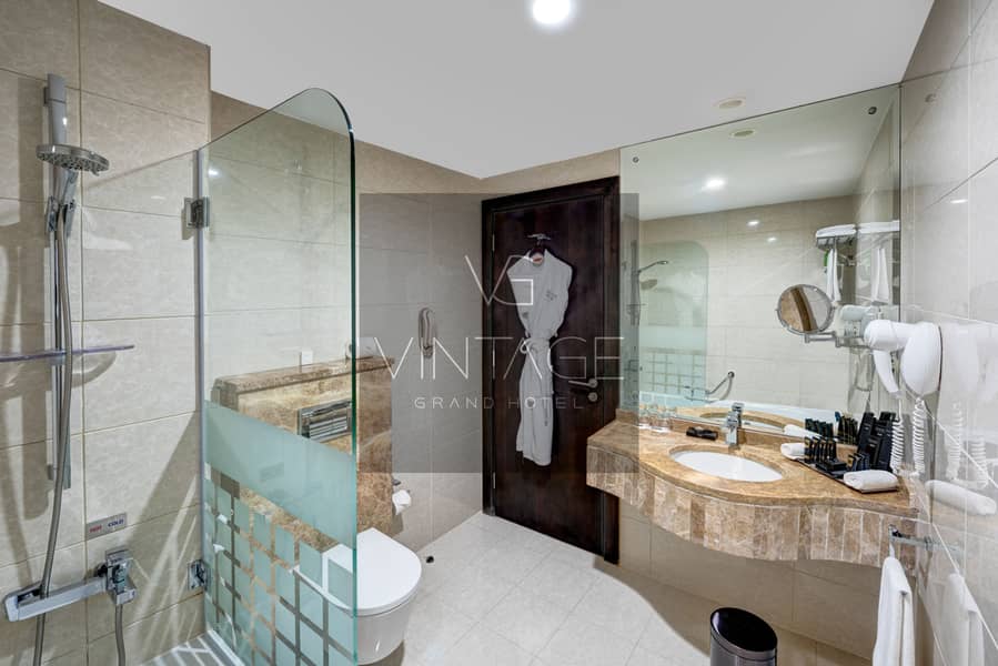 3 Ghaya Grand Hotel Dubai - One Bedroom Bathroom 2. jpg