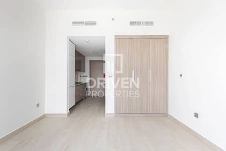 Studio for Sale in Meydan City, Dubai - Brand New and Bright with Partial Lagoon View