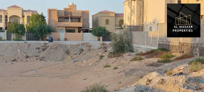 Plot for Sale in Al Manama, Ajman - For sale land in Manama, Ajman, District 11, in the middle of Al-Amar, freehold for all nationalities, at a price of a snapshot