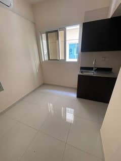 For rent in Ajman, a studio in Rawda 1. The price is 10,000 dirhams in 4 payments. Insurance is a check. Close to all services. The studio is on the g