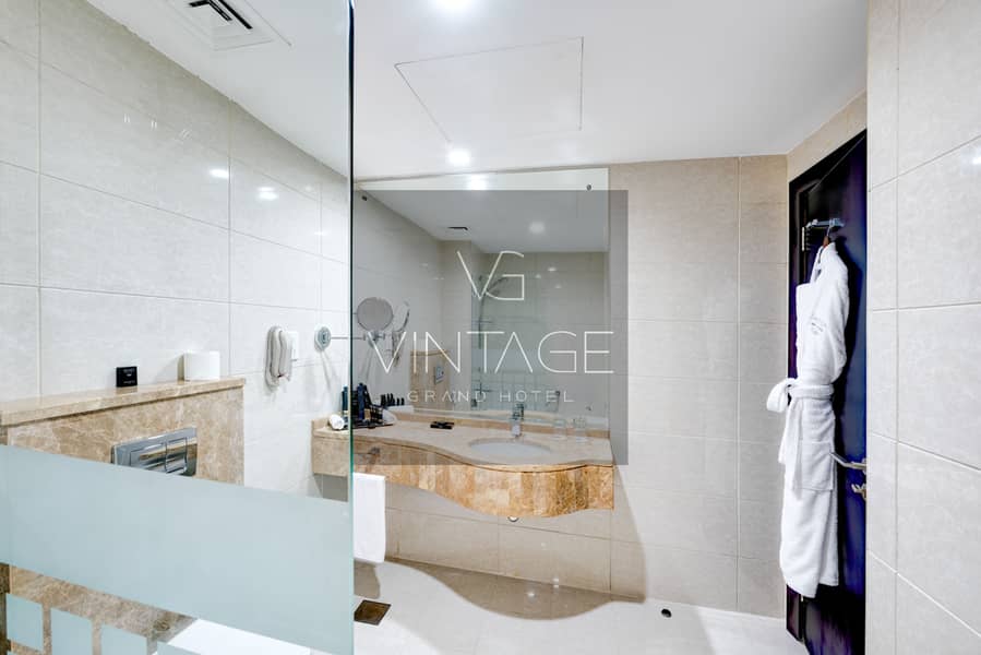 5 Ghaya Grand Hotel Dubai  - One Bedroom Bathroom 4-2. jpg