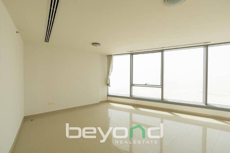 4 spacious-living-room-of-1-bedroom-apartment-in-sky-tower-al-reem. jpg