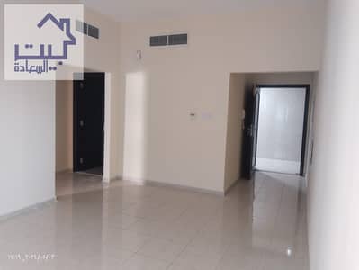 For rent in Ajman, a room and a hall in Al Rashidiya 1, very close to Al Mina Street, payment facilities in 4 or 6 payments One bathroom and a balcony