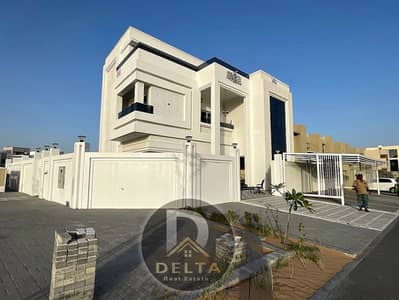 For lovers of luxury large corner villa furnished with electricity water  air conditioners ready to move in for sale in Ajman freehold large setback