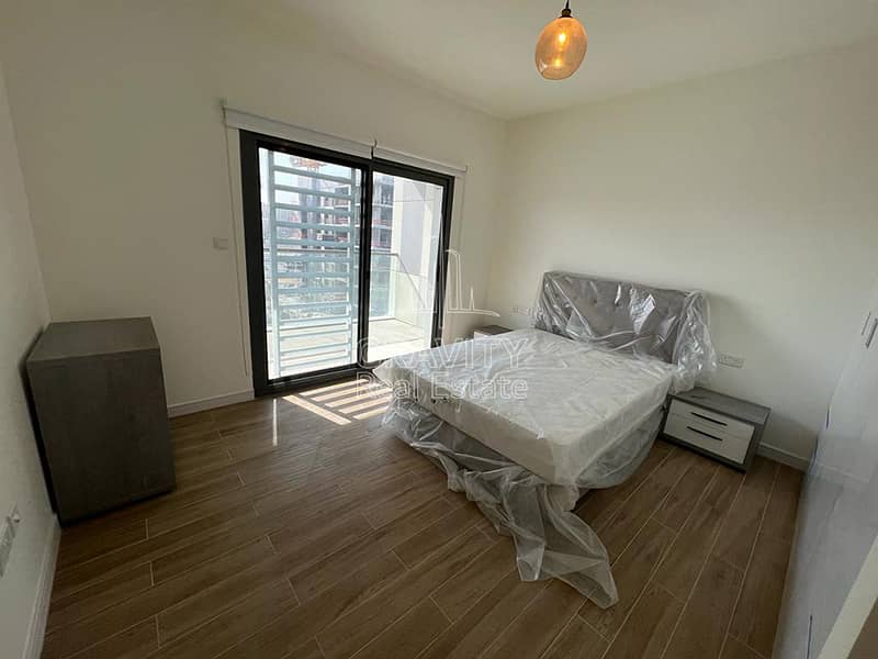 2 amazing-bedroom-with-brand-new-lavish-bed-wooden-floors-and-balcony-in-al-raha-lofts-2. jpg